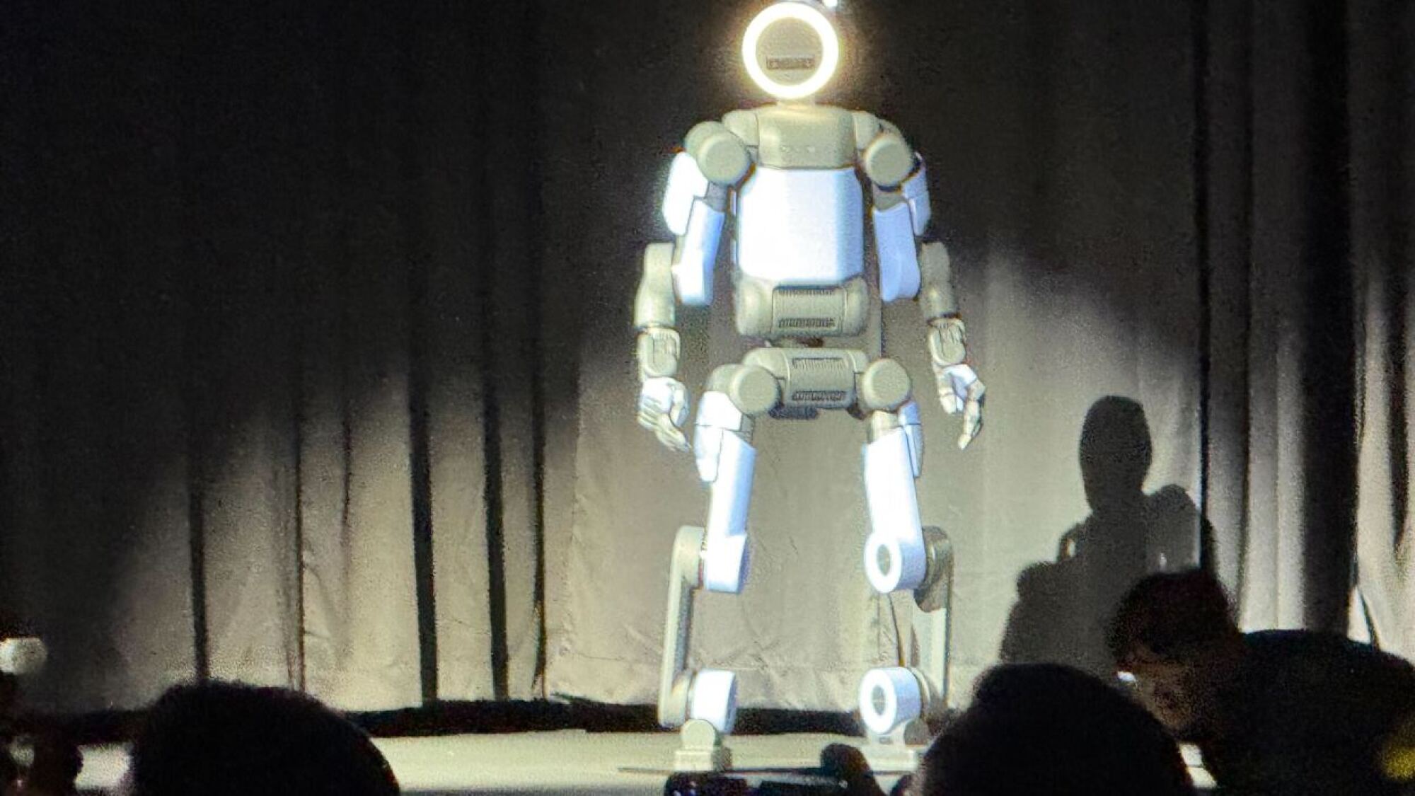 The humanoid Atlas robot from Boston Dynamics standing on stage at CES 2026.