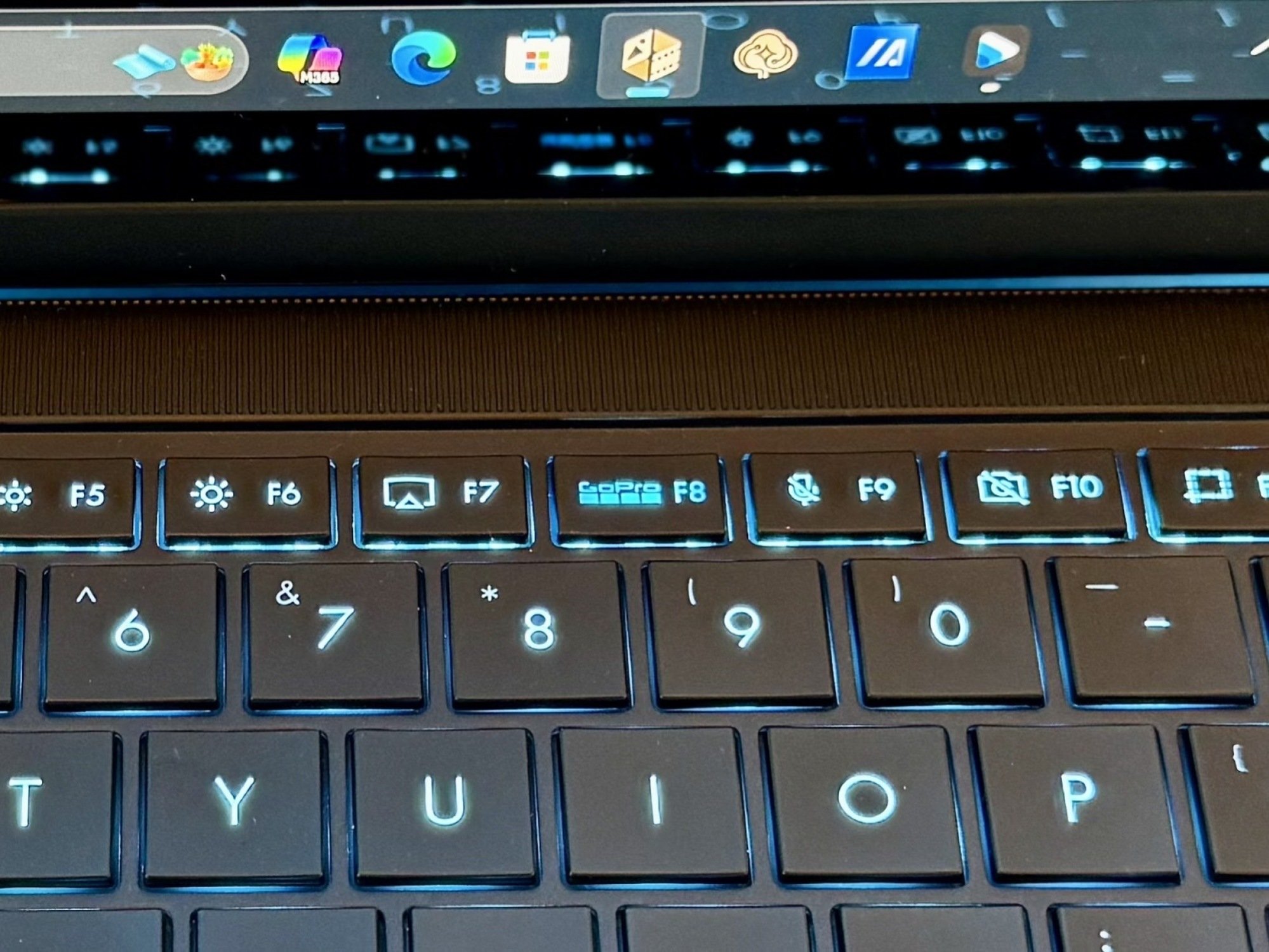 A close-up of keys on a laptop keyboard